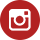 A red and white icon of an instagram logo.