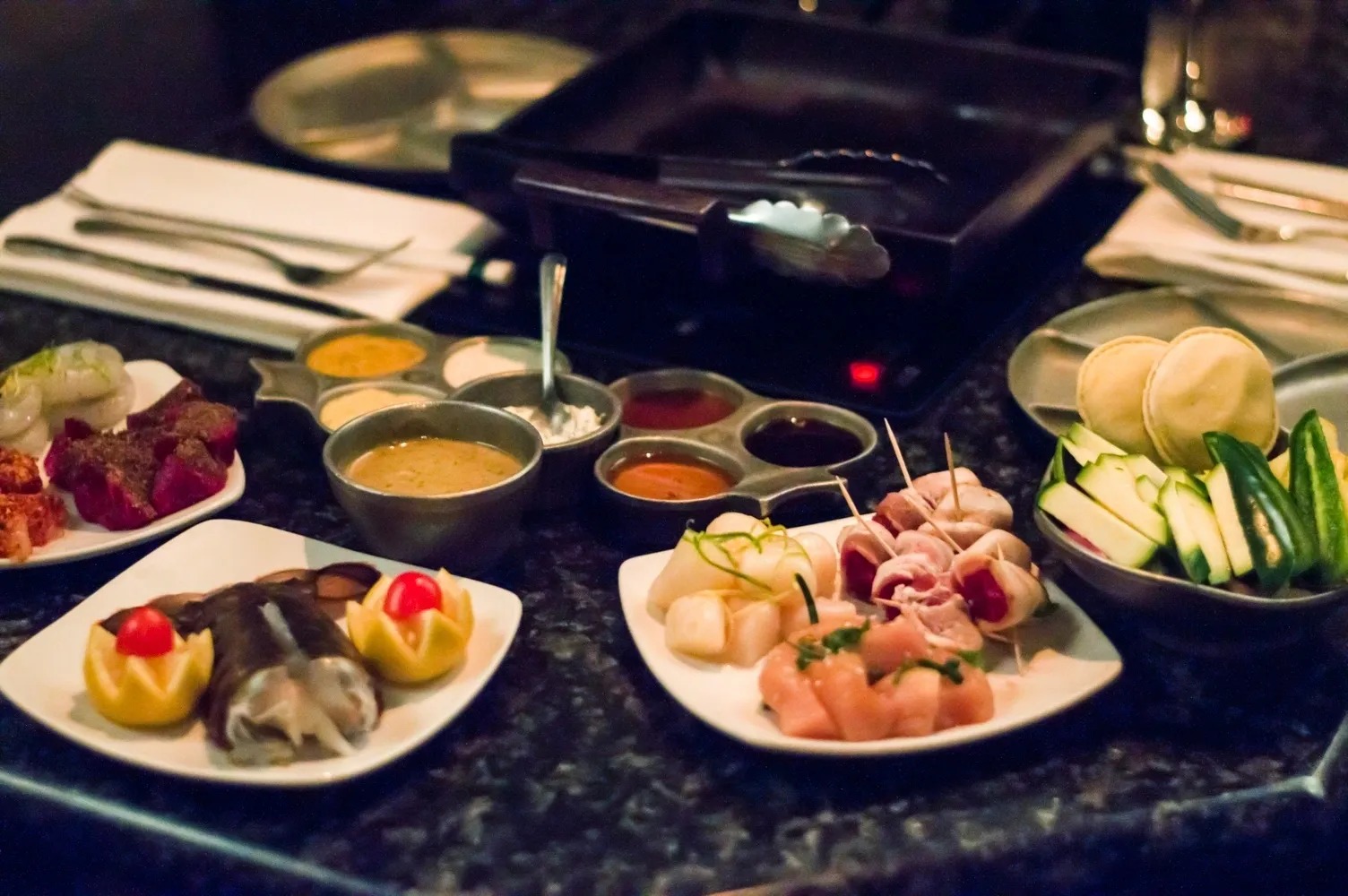 A table with plates of food on it