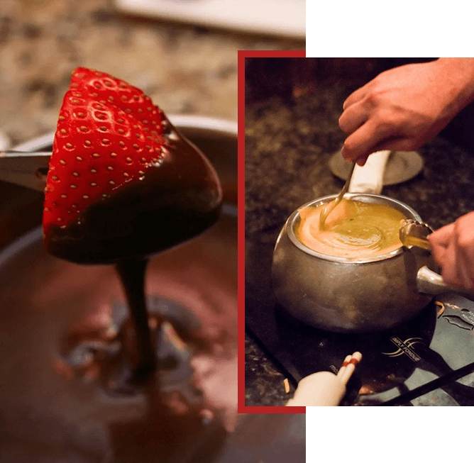 A close up of a spoon in chocolate and a person pouring liquid into it